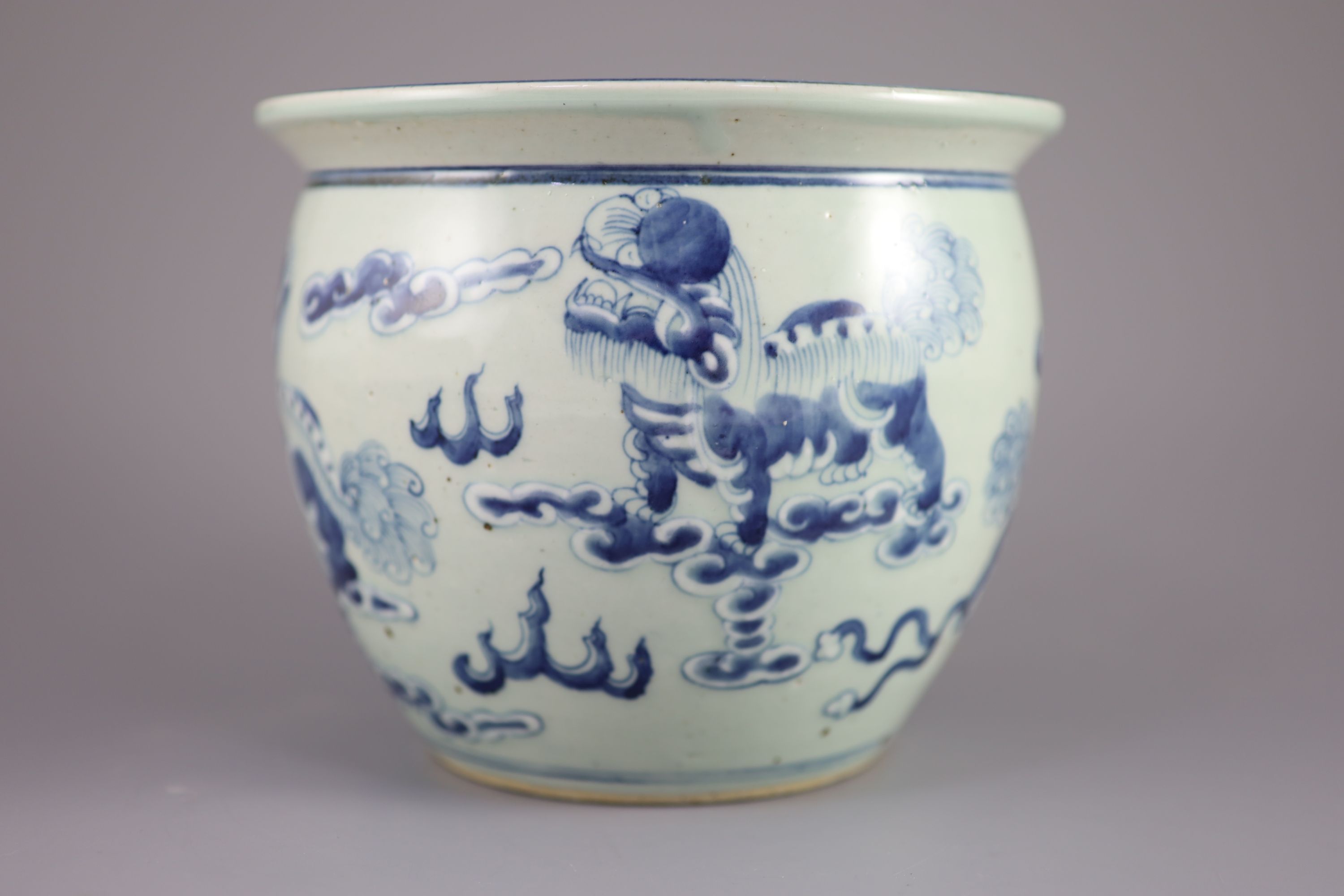 A Chinese blue and white 'lion-dog' flower pot, 20cm diameter